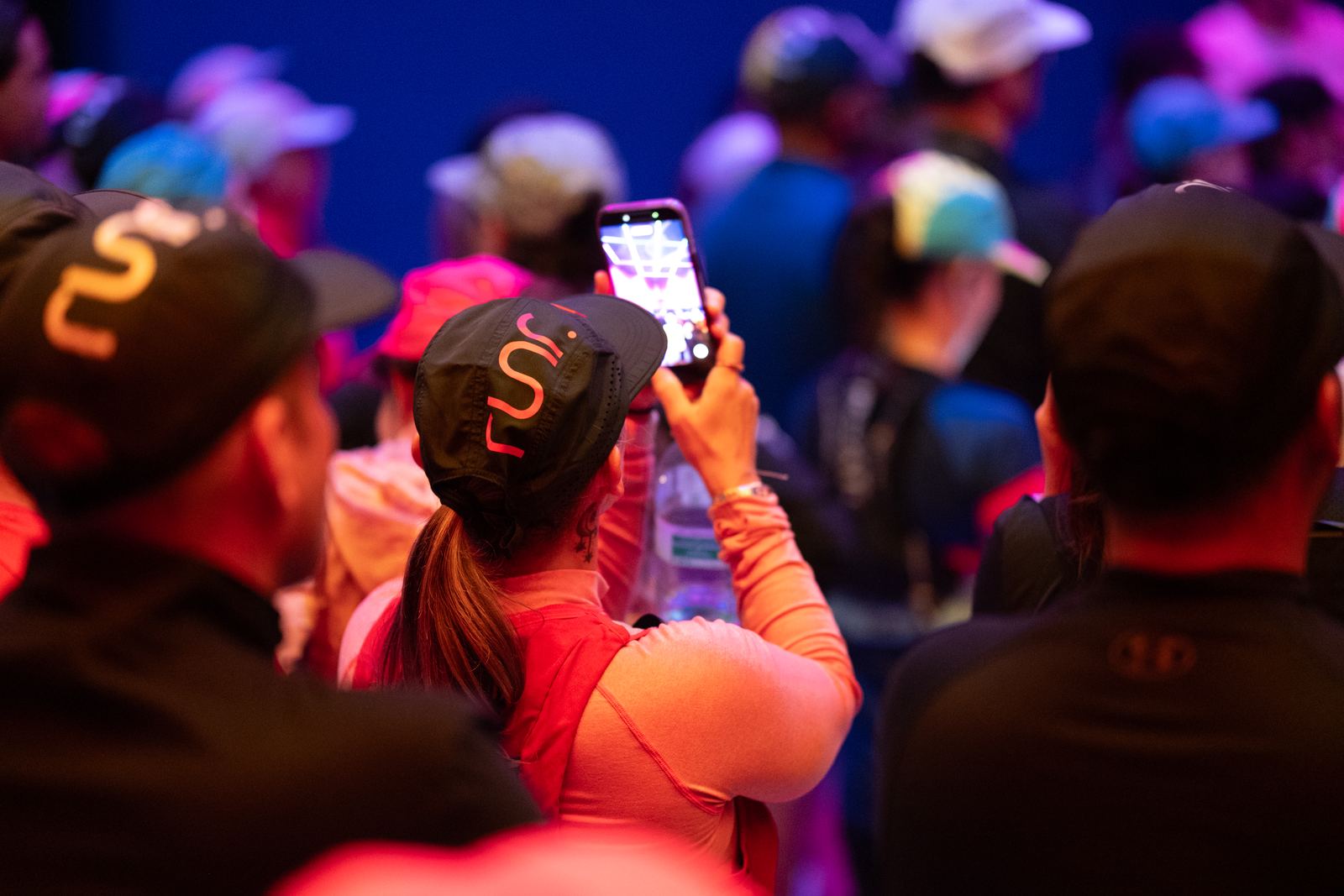 An attendee capturing the atmosphere at the runr event